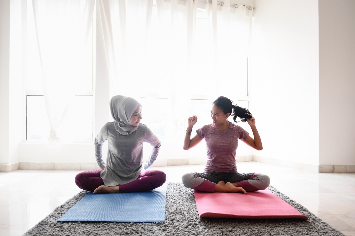 2 women on yoga mats